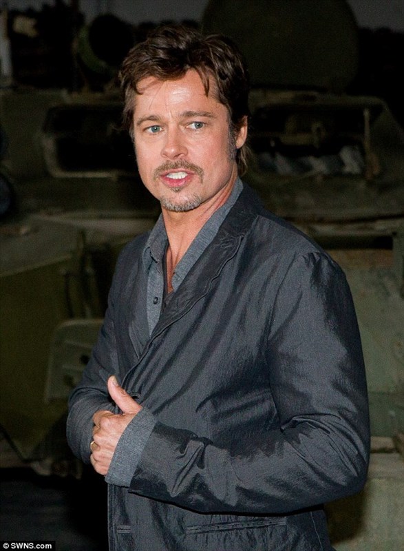 Brad Pitt shows off his wedding ring for the first time after marrying Angelina Jolie